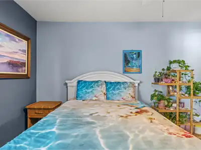 Cozy coastal bedroom with beachy decor and a calming, plant-filled vibe