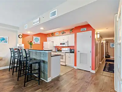 Bright open kitchen with breakfast bar seating for four